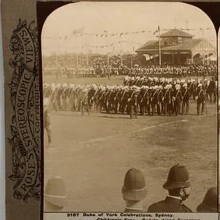 Rose's Stereoscopic Views card of the Duke of York celebrations in Sydney, 1901, with sailors marching across a sports ground