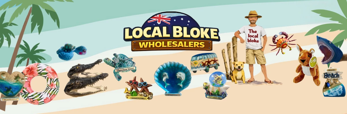 Local Bloke Wholesalers banner: the Local Bloke character with his dog on a beach, surrounded by souvenirs including destination-named resin turtles, starfish, shells and hearts, crocodile heads, a kombi van, a snow globe, a plush kangaroo and a shark hand puppet.