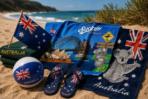 Australian flag and Sydney beach towels, an Australian flag, flag beach ball and flag thongs on the sand