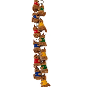 A string of plush kangaroo keyrings wearing coloured jumpers